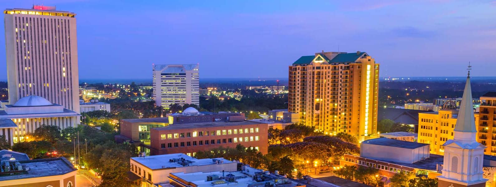 Neon color image of a band playing and people singing along